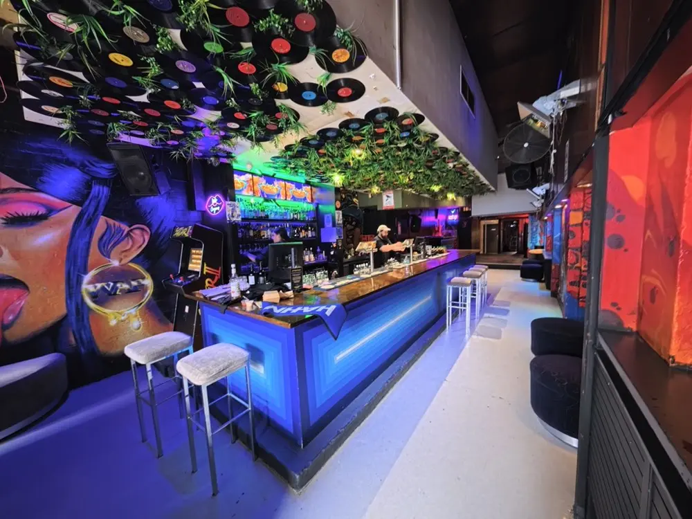Completed Blue Bar commercial interior in Prahran with illuminated bar, murals and detailed ceiling treatment