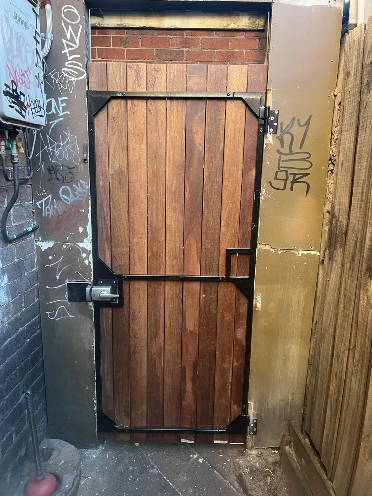 New timber gate fitted to an existing alley entrance