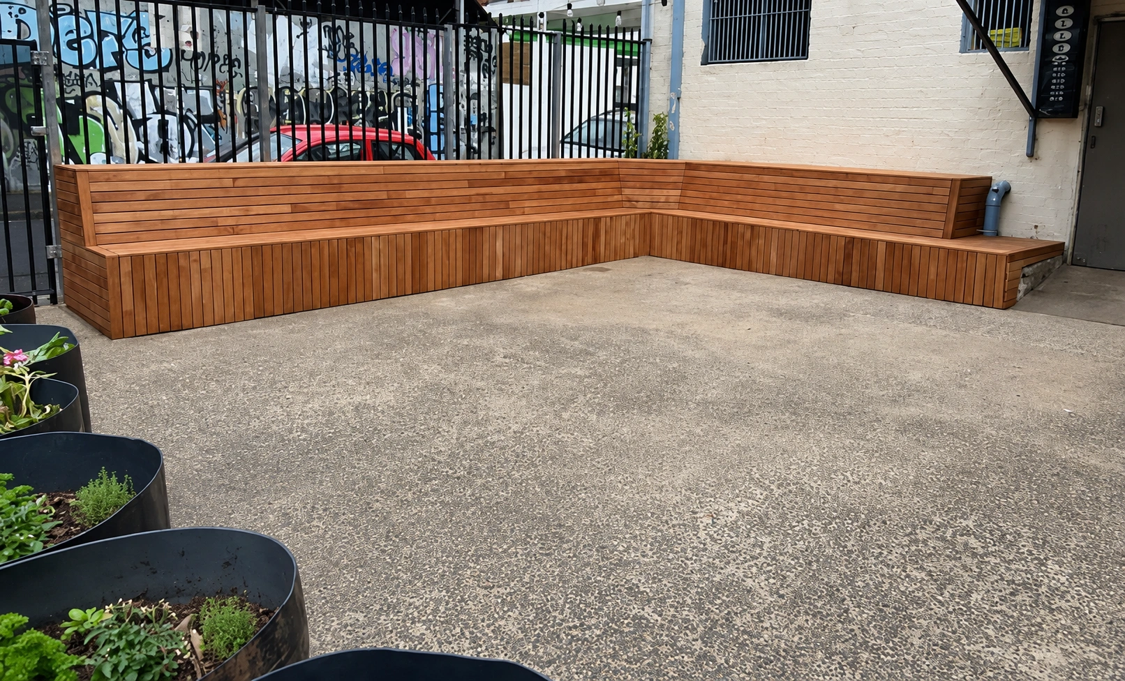 Custom L-shaped Merbau outdoor seating at The Night Cat in Fitzroy
